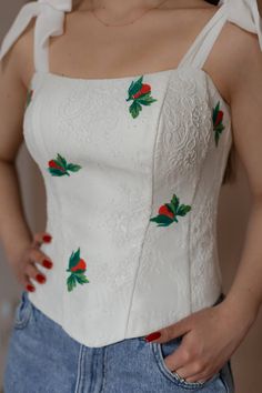 This exquisite corset is made of delicate chantallier lace ivory color, which gives it a special elegance. The base of the product is made of satin, which is covered with fine lace that fits perfectly on the body, with inserted cotton cups and plastic bones. Embroidery on the corset adds uniqueness and originality to the product. Embroidered motifs are placed throughout the corset, creating a harmonious and refined image. The corset has convenient lacing on the back that allows you to adjust the fit and provides comfortable wearing.  This original model is ideal for special occasions when you want to feel charming and confident. You can order an individual tailoring of this corset according to your measurements for the celebration of the wedding.  Individual tailoring is possible. To choos Elegant White Lace Bodice, White Lace Bodice With Sweetheart Neckline, White Lace Wedding Corset, White Fitted Wedding Corset, White Corset With Lace Bodice And Fitted Design, Wedding Corset With Delicate Lace, Elegant Wedding Corset With Delicate Lace, White Wedding Corset With Delicate Lace, White Delicate Lace Wedding Corset