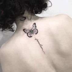 a woman with a butterfly tattoo on her back