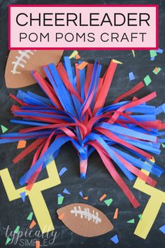 paper pom poms on a chalkboard with footballs and confetti