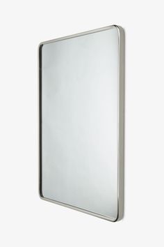 a square mirror hanging on the wall