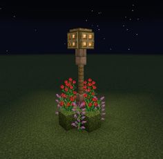 an image of a tree house in the middle of some flowers and grass at night