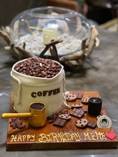 a birthday cake made to look like a bucket full of chocolate chips and cookies with the words coffee on it