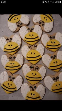 some cookies are shaped like bums and have faces painted on them to look like bees