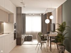 a dining room and kitchen area in a small apartment with white walls, wood flooring and beige curtains