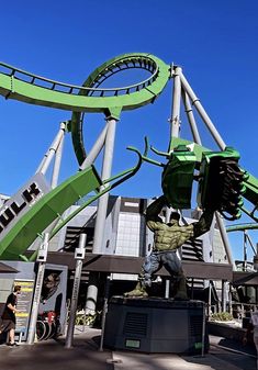 a statue of a man riding a roller coaster