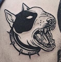 a man with a tattoo on his stomach has an image of a dog's head