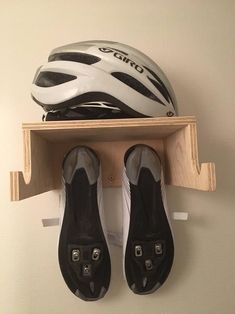 there is a pair of shoes and a helmet on the shelf