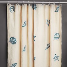 a curtain with shells and starfishs on it