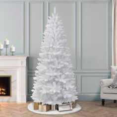 a white christmas tree in a living room