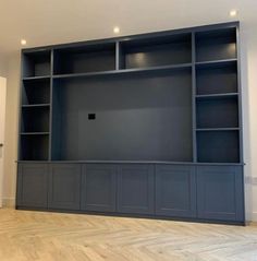 an empty room with some bookshelves in it