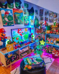 a room filled with lots of toys and pictures on the wall above it is a tv