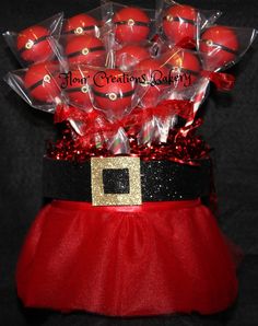 a red and black santa hat filled with candy