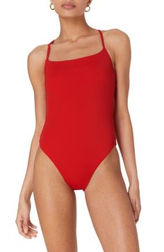 This timeless one-piece features a classic silhouette and an adjustable lace-up back for the perfect fit. Cheeky back coverage   80% recycled nylon, 20% spandex   Hand wash, dry flat   Imported Red Elastane Swimwear, Classic Sleeveless Swimwear For Summer, Classic Summer Swimwear, Classic Sleeveless Summer Swimwear, Fitted Solid Color Bodysuit With Tie Back, Classic One-piece Swimwear For Summer, Red Sleeveless Swimwear With Adjustable Straps, Red Backless Swimwear With Adjustable Straps, Red Tie-back Swimwear For Beachwear