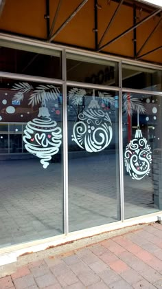 an image of a store front window that has been decorated with decorative designs on it