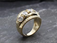 Thick Gold Band set with a Created CZ Diamond in a perfect clarity with brilliant sparkle, at 5mm each, weighting about 3 Carats combined.Wide Gold Ring design made of Solid 925 Sterling Silver ☞ made to last.**The ring is plated with 18k Gold (the thickest plating - 3 Micron) over Solid 925 Sterling Silver.Matching Pendant & Matching Earrings - please ask me☞ Choose your size ☞ I resize (before shipping) for FREE to Any size*⌛Last Ring left ⌛Details : ♥ Each item comes in a cute GIFT BOX ✓♥ Gold Ring Design, Thick Gold Band, Wide Gold Ring, Affordable Rings, Shield Ring, Sparkly Ring, Gold Ring Designs, Real Jewelry, Diamond Ring Settings