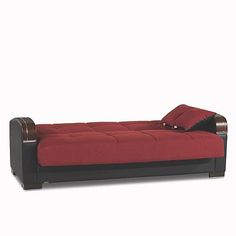 a red and black couch sitting on top of a white floor