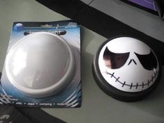 a halloween decoration with a white ball and black marker used to add spooky eyes