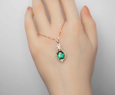 "Oval Emerald Gemstne Jewelry High Quality unique Artisan design full sterling silver made ◆◆Pendant Main stone: 8*10mm Created emerald gemstone Pendant length ( include bail) :26mm Holder (bezel & Bail) : Rose gold coated 925 Sterling Silver Accent Stone: Sim Diamond ◆◆ Necklace chain : Rose gold coated 925 sterling silver Box Chain with length option from 16\" ~20\". The model wearing the default size 18\". 16 inch ≈ 40cm 18 inch ≈ 45cm 20 inch ≈ 50cm ◆◆Please pay attention to the size Som Green Emerald Necklace, Emerald Style, Fire Opal Necklace, Necklace Rose Gold, Emerald Pendant, May Birthstone, Emerald Necklace, Necklace Rose, Silver Box