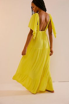 Forever free and flowy, this effortless maxi dress from our free-est collection is featured in a V-neck, tiered silhouette with flutter sleeves for added shape. * Soft, textured fabrication * Elastic empire waist * Effortless, pull-on style | La La Maxi Dress by free-est at Free People in Yellow, Size: S Golden Kiwi, Bohemian Maxi Dress, Silk Velvet, Shop Maxi Dresses, Textured Fabric, Flutter Sleeves, Free People Dress, Boho Clothing, Empire Waist