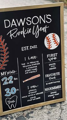 a chalkboard sign with some baseballs on it