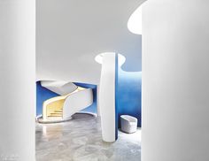 a white room with blue and yellow accents on the walls is pictured in this image