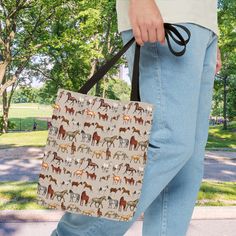 Discover our Horse Patterned Tote Bag, a stylish and durable choice for equestrian enthusiasts and eco-conscious shoppers. This cotton tote is machine washable and available in three sizes, making it perfect for daily use, whether as a shopping bag, book bag, or farmers market companion. The eye-catching horse print adds a unique charm, while the eco-friendly textile ensures sustainability. This tote bag is a fantastic accessory and an ideal horse gift for loved ones. Care Instructions: Machine Recyclable Tote Bag For Outdoor Activities, Rectangular Reusable Outdoor Bags, Eco-friendly Rectangular Outdoor Bag, Eco-friendly Rectangular Bags For Outdoor Activities, Reusable Rectangular Bags For Outdoor Activities, Rectangular Reusable Bags For Outdoor Activities, Farmers Market Bag, Horse Pattern, Horse Gifts