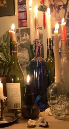 candles and bottles are sitting on a table