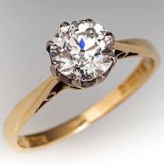 This classic circa 1976 English 18k yellow gold solitaire style engagement ring contains one (1) old European cut diamond weighing 1.02 carats that is set into an eight-prong setting. The ring is finished with a reverse tapered shank. The inside shank is stamped with London, England hallmarks. The ring measures 7.2mm at the top, rises 7.3mm above the finger, tapering to 1.6mm wide and 0.9mm thick at the base of the shank. Makers Mark: CB&Co. It is currently a size 6. Classic 14k Gold Diamond Ring, Classic Yellow Gold Diamond Ring With Round Cut, Classic Gold Wedding Ring With Single Diamond, Classic Yellow Gold Diamond Ring, Vintage Solitaire Diamond Ring In Yellow Gold, Classic Single Diamond Ring, Classic Diamond Ring For Anniversary, Classic Solitaire Diamond Ring For Anniversary, Yellow Gold Solitaire