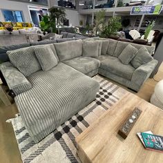 a large sectional couch in a furniture store