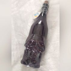 a glass bottle with a skull on it