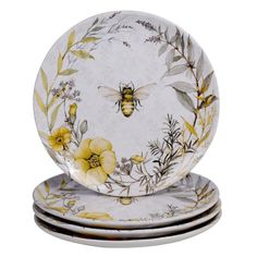 three plates with yellow flowers and bees on them