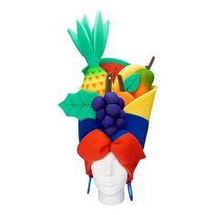 a hat with fruit on it is shown in the shape of a human headpiece