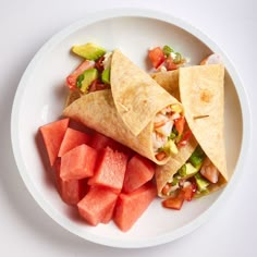 watermelon and guacamole burritos on a plate with salsa