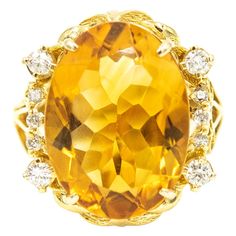 Gorgeous yellow orange color oval faceted citrine accented with 4 prong set approximate size .08 carat diamonds and six 3 prong set approximate .02 carats diamonds. Approximate total weight in diamonds is .44 carats. The sides have open scroll design that resembles a heart. The citrine measures 13.5mm x 8.5mm. The ring is 10k yellow gold. US size 8.5. It can be sized. Diamond Dress Ring, Yellow Gold Cocktail Ring, Gold Starburst, Jaune Orange, Yellow Rings, Yellow Jewelry, Vintage Jewelry Art, Gold Cocktail Ring, Purple Sapphire