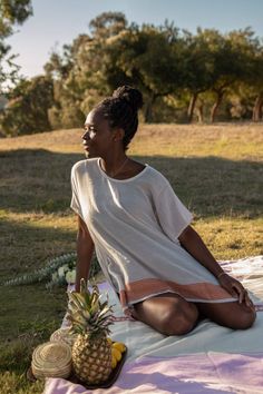 Swap your oversized tee for this semi-sheer cotton top that features a bold patterned hem with a rich sheen--a design inspired by Habesha Kemis, the traditional dress for Ethiopian women. About the Maker: Menby DesignFounded by Menbere Alemayehu, a native of Ethiopia committed to preserving traditional Ethiopian hand-weaving and hand-embroidery by introducing the techniques into pieces for the contemporary home and closet. Menby is dedicated to the economical empowerment of Ethiopian women throu Bohemian Short Sleeve Tops For Loungewear, Summer Tunic Tops For Loungewear, Casual Short Sleeve Tunic For Festival, Traditional Summer Tunic Top, Bohemian Relaxed Fit Tunic Short Sleeve, Bohemian Relaxed Fit Short Sleeve Tunic, Cotton Short Sleeve Tunic For Festivals, Habesha Women, Ethiopian Women