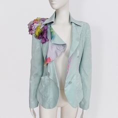 CHRISTIAN LACROIX water green silk jacket with floral brocade, ruffled collar and silk ponpon on the shoulder vintage 80s Amazing silk blazer jacket by French brand Christian Lacroix. The jacket has a slightly fitted cut and a beautiful plunging ruffled neckline with a print on the reverse. There are two front pockets and a single button to close it. The short jacket is decorated with strips of silk scarves in purple tones, creating a sort of pom-pom on one of the shoulders. The jacket is made f Spring Party Blazer With Ruffles, Green Silk Outerwear For Spring, Wedding Blazers, 80s Jacket, Silk Coat, Silk Blazer, Purple Tones, Boho Jacket, Ruffled Neckline