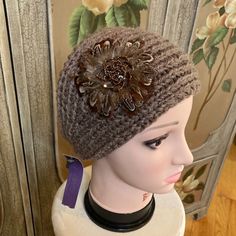 Item: David & Young Brown Knit Head Band Nwt Hat With Feathers Size: Spot Clean Color: Brown Fabric: Acrylic Care: Spot Clean Accents: Feather And Bead Flower, Two Buttons In Back For Closure Origin: China Condition: New With Tag Inventory #5235 **Comes From A Smoke-Free Home Brown Crochet Knitted Hat For Spring, Beige Knit Crochet Hat For Fall, Beige Crochet Knit Hat For Fall, Fall Beige Crochet Knit Hat, Beige Crochet Hat For Fall, One Size Fits Most, Adjustable Soft Knit Crochet Hat For Fall, Brown Soft Knit Crochet Hat For Fall, One Size Brown Crochet Hat With Soft Knit, Brown Knit Crochet Hat One Size