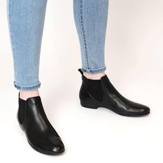 Wear an ankle boot in a classic design, traditionally handcrafted by legendary craftsmen in Portugal. Nila Black by EOS in black oozes class and relaxed, casual comfort. The supple leather upper gently moulds to the shape of your foot while the handmade leather lining and the hint of a heel offer day-long comfort. Sparkle Gift, Comfy Boot, Black Leather Ankle Boots, Comfortable Boots, Shoe Care, Boot Sandals, Handmade Leather, Leather Ankle Boots, Eos