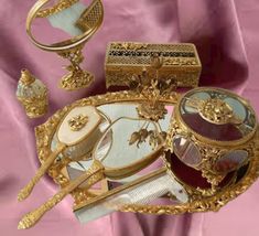 an elaborately decorated tray with gold trimmings and other decorative items on it