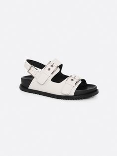 Editor's NotesRareness' shoes are designed for comfortable and basic styles.- Bold buckled double strap sandals- Cushioned sole bottom- Subtle glossy leather- Easy slide-in design- Modern almond toe shapeMeasurements(in.)- Size: KR 225MM (US 5.5) ~ KR 250MM (US 8)- Heel Height: 1.2 in.*Fits true to size.Composition & Care- Calf Leather- Lining: Pigskin Leather- Insole: Kidskin Leather- Avoid direct heat and moisture- Professional cleaning is recommendedDesigner- by rareness Double Strap Sandals, Pig Skin, Slide In, Professional Cleaning, Basic Style, Bold Fashion, Design Modern, Strap Sandals, Calf Leather