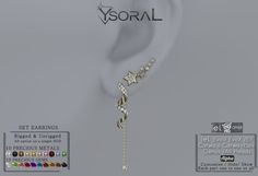 an earring with stars hanging from it's side and the word, yoral