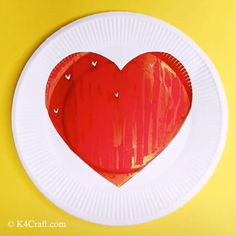 a paper plate with a red heart on it