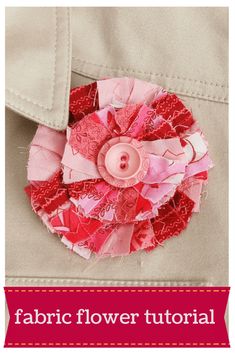 the fabric flower has been made into a broochet with pink and red flowers