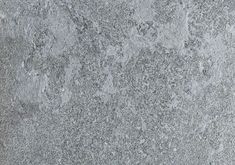 a close up view of the surface of a concrete wall