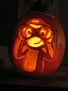 a pumpkin carved to look like a cartoon character