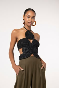 The Archer Top is a sculptural wonder. Symmetrical, hand-crocheted raffia patterns create interwoven forms that seductively reveal thoughtfully placed cut-outs. A halter neck adds a snug hold to this slimming garment. The handmade nature of this artful top gives it a bespoke aura. Chic Fitted Crochet Top For Party, Fitted Crochet Top For Spring Night Out, Black Crochet Top For Summer Party, Black Sleeveless Crochet Top For Party, Black Crochet Top For Spring Party, Fitted Black Crochet Top For Party, Black Chic Crochet Top For Night Out, Chic Black Crochet Top For Night Out, Diy Crochet Top