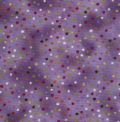 a purple background with multicolored polka dots