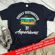 a t - shirt with the words easily distracted by aquariusns printed on it