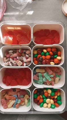 a container filled with lots of different types of candy