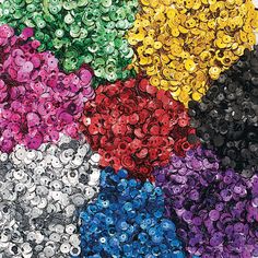 many different colors of sequins are arranged in a circular pattern on a white background